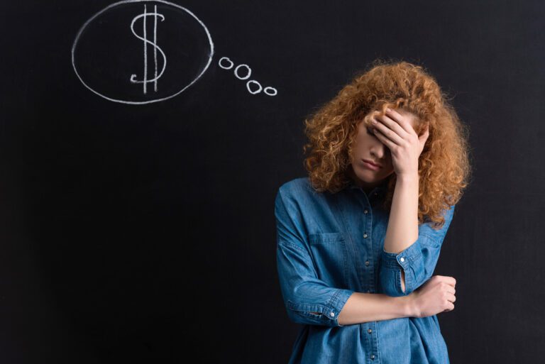 upset pensive girl with dollar sign.