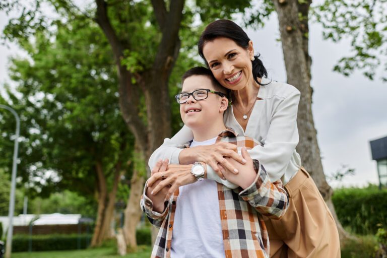 mother-and-son-embracing-in-park